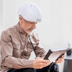Man wearing red light therapy helmet