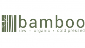 Logo for Bamboo featuring a stylized bamboo stalk on the left, with the words raw • organic • cold pressed underneath the brand name in green text on a white background.