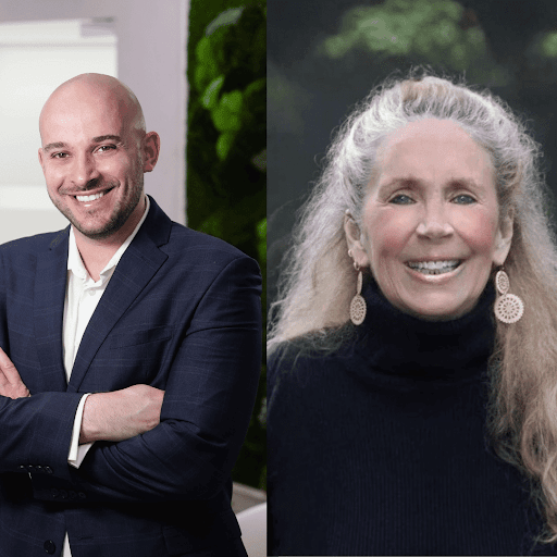 A bald man in a dark suit stands smiling with arms crossed beside a smiling older woman with long gray hair, both advocates for healthcare for Lyme Disease, in front of a natural green background. oral systemic health