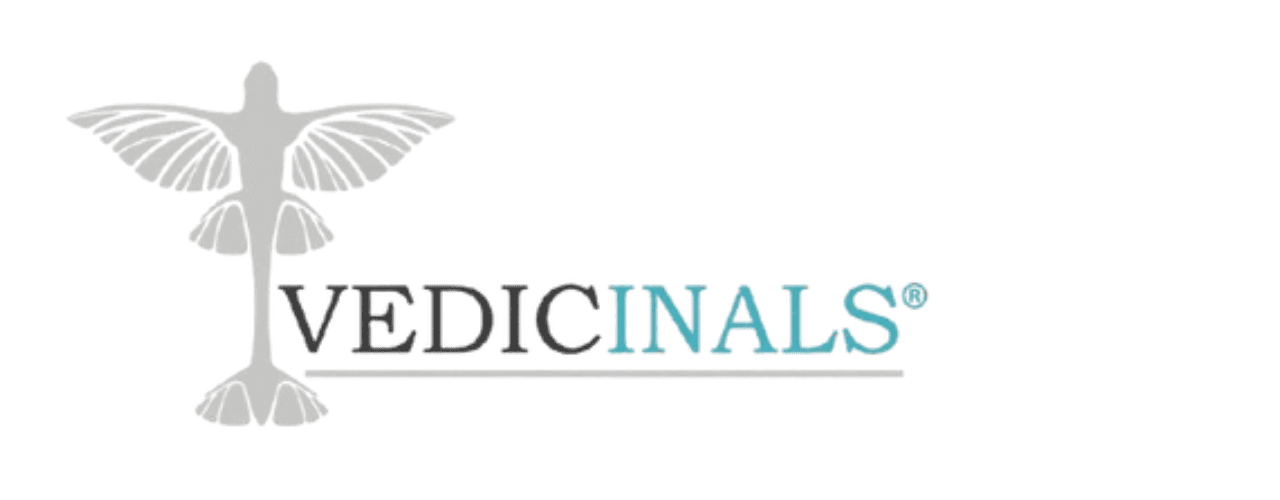 Logo with a stylized bird on the left and the text VEDICINALS® to the right; VEDIC is in black and INALS is in light blue. The background is white.